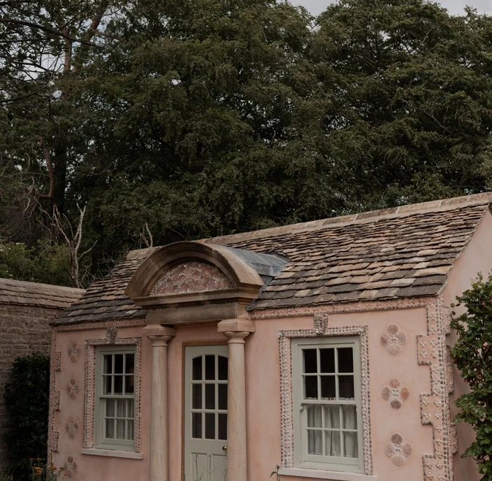 The Chicest New Pool Party Spot in the English Countryside Features a Shell-Encrusted Pink Pool House